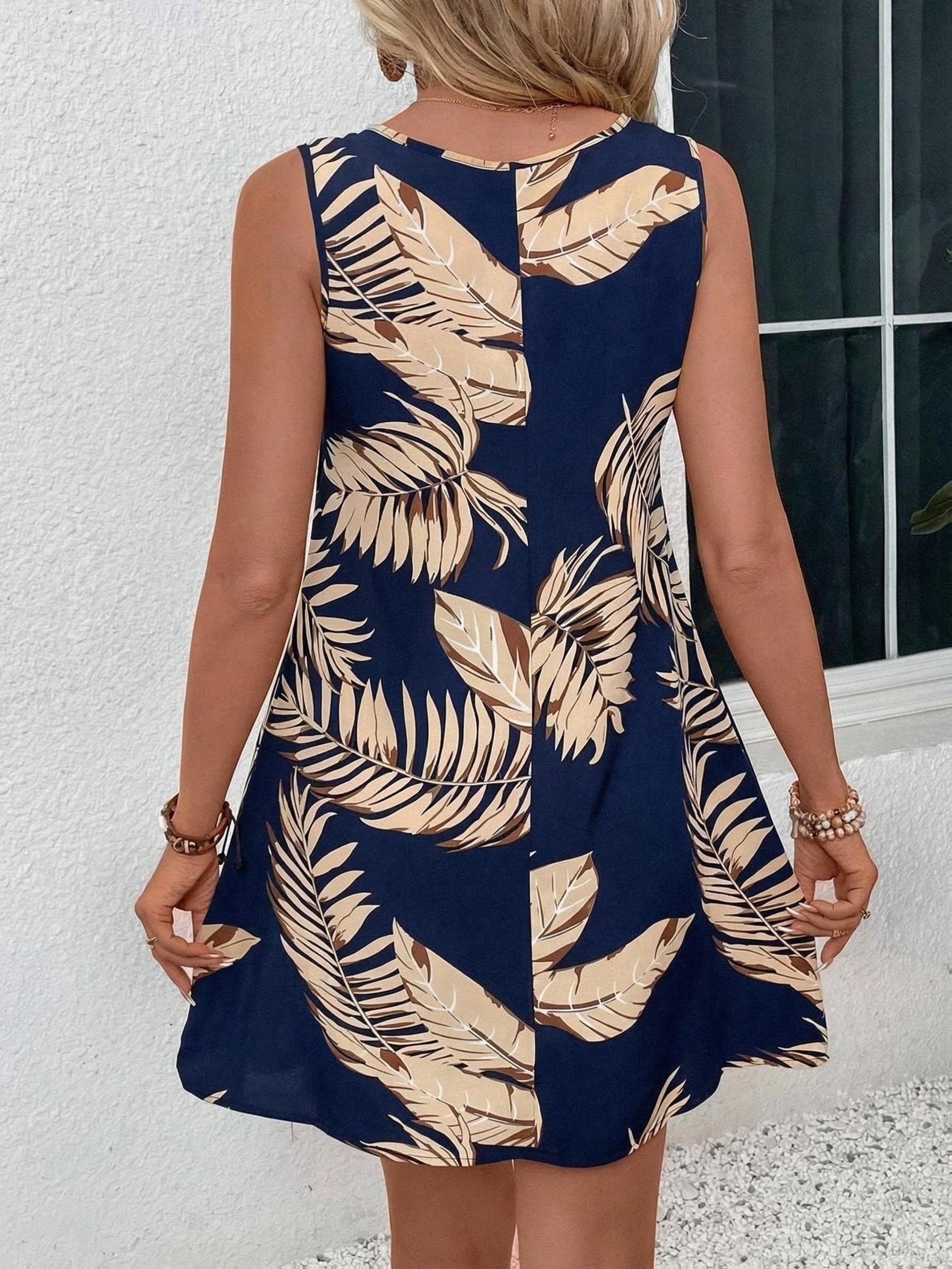 New 2026 Summer Collection: Elegant Summer Leaf-Print Comfortable Spaghetti Suspender Dress. A Vacation Essential, One for Everyone. Features a Unique Leaf and Print Design. Loose Fit Suits All Body Types. White Circular Buttons Add Character - Image 9